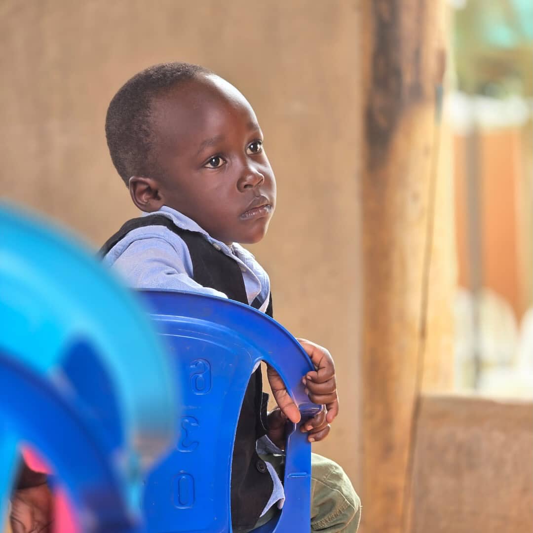 A young boy looking forward