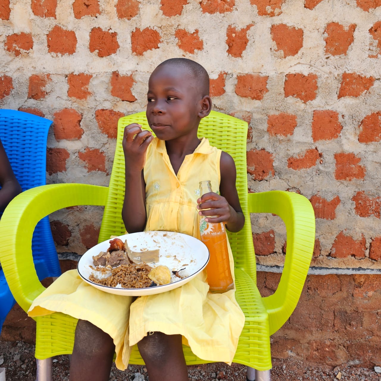 A girl enjoying a hot meal and a drink