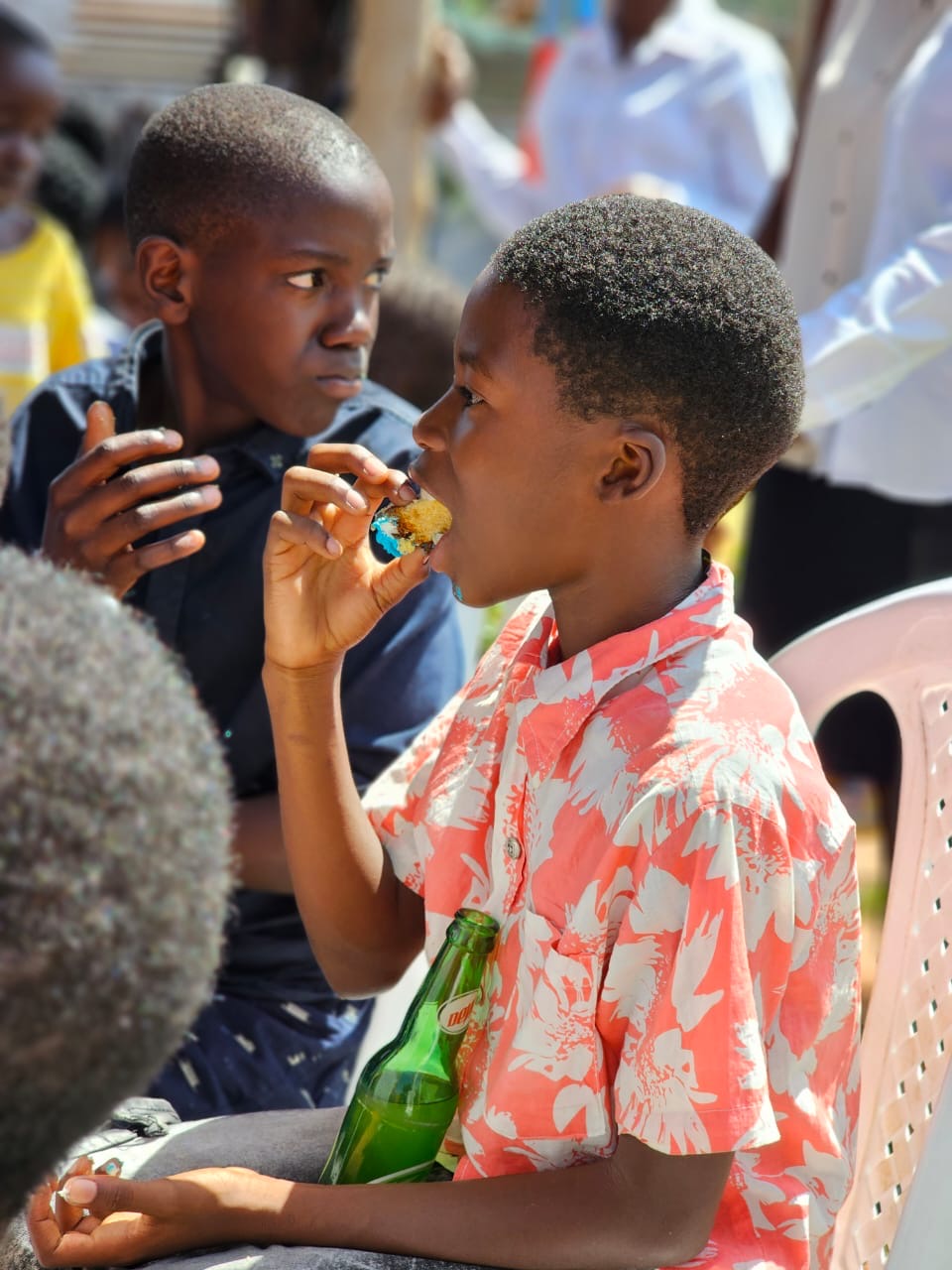 Two boys sharing a snack